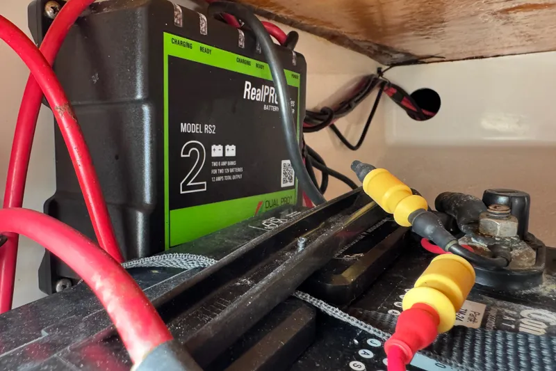 Slide: The Image of Battery charger setup in a 2022 Carolina Skiff 19 LS boat. - 62
