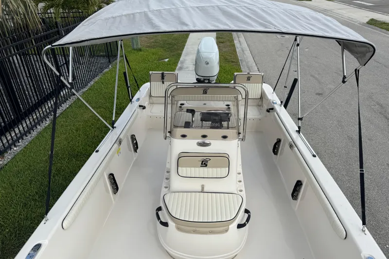 Slide: The Image of 2022 Carolina Skiff 19 LS boat with canopy, spacious seating, and modern design. - 63