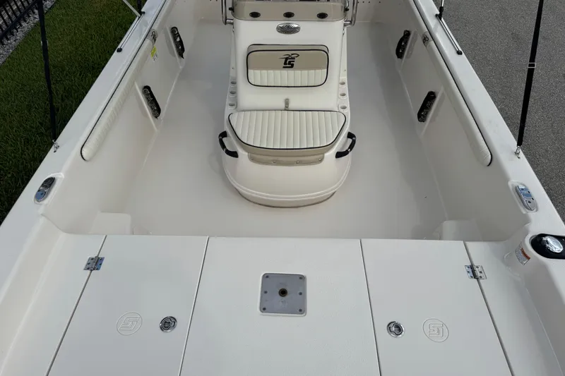 Slide: The Image of 2022 Carolina Skiff 19 LS boat interior with seating and storage compartments. - 64