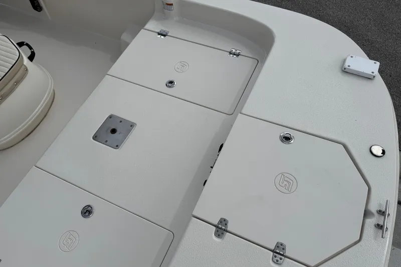 Slide: The Image of 2022 Carolina Skiff 19 LS boat deck with storage compartments and seating. - 65