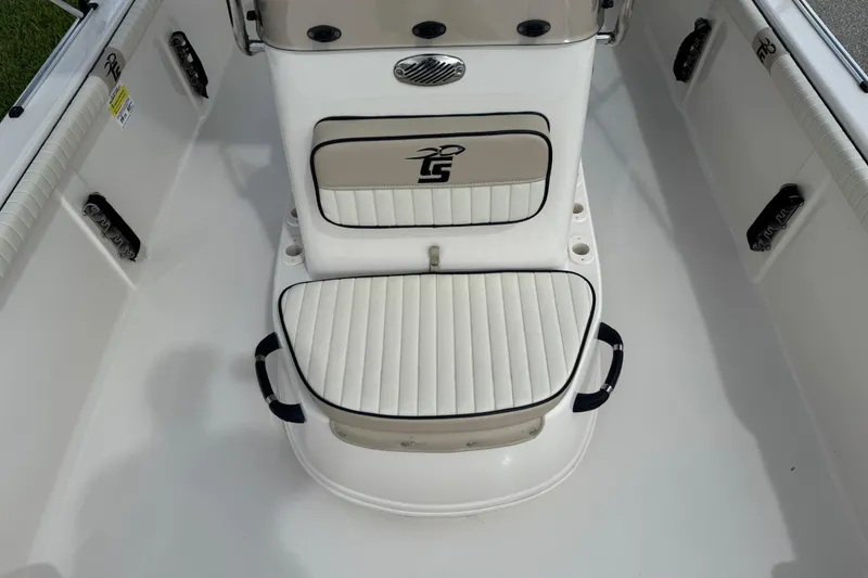 Slide: The Image of 2022 Carolina Skiff 19 LS boat interior with cushioned seating and storage. - 66