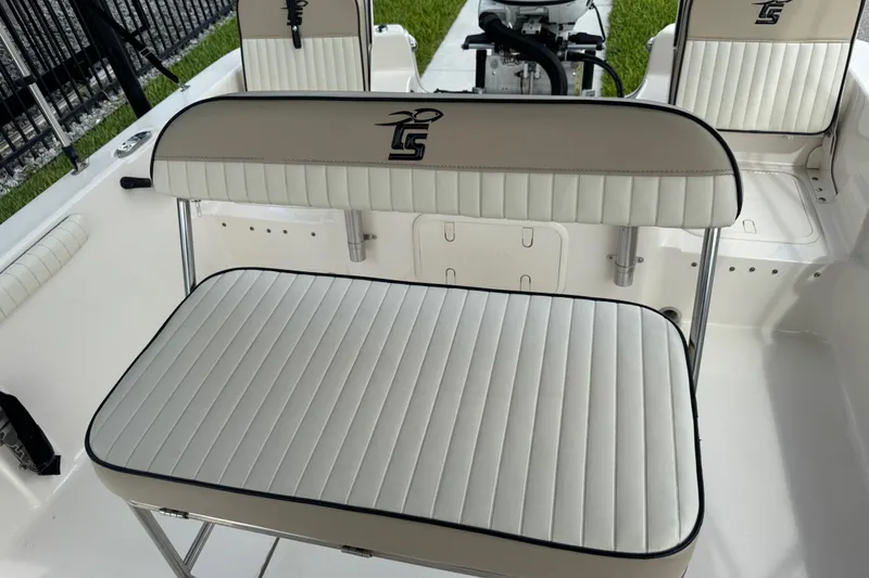 Slide: The Image of 2022 Carolina Skiff 19 LS boat interior with cushioned seating and sleek design. - 75