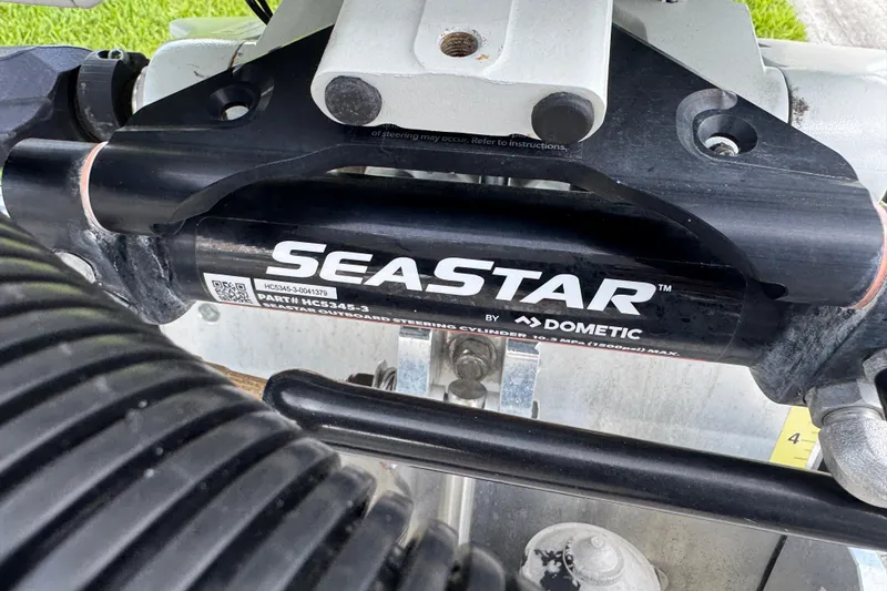 Slide: The Image of SeaStar hydraulic steering cylinder by Dometic on a 2022 Carolina Skiff 19 LS boat. - 78