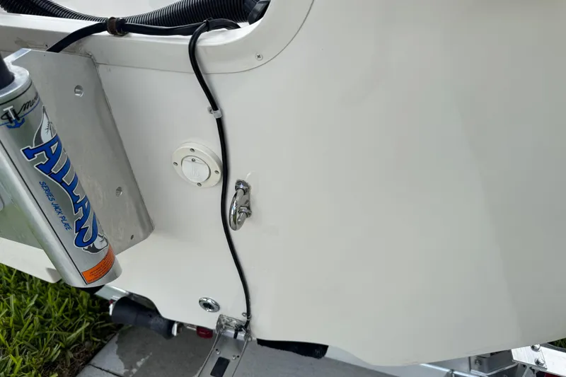 Slide: The Image of 2022 Carolina Skiff 19 LS boat detail with Atlas jack plate and wiring. - 80