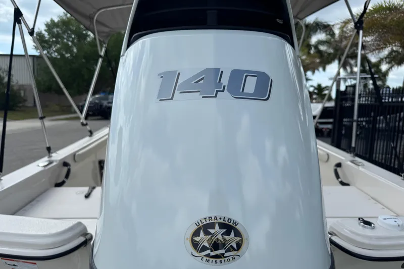 Slide: The Image of 2022 Carolina Skiff 19 LS boat with "140" and ultra-low emissions badge. - 9