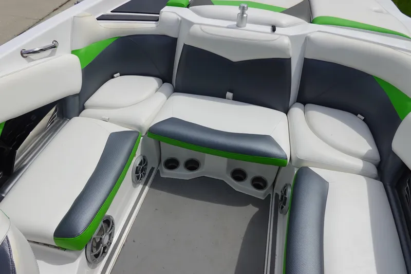 Slide: The Image of Interior seating of a 2015 Tigé R20 boat with green and gray accents. - 10