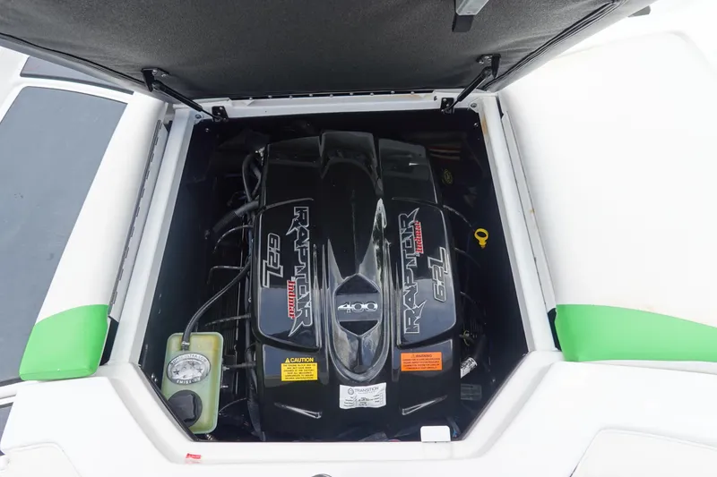 Slide: The Image of 2015 Tigé R20 boat engine compartment featuring a Raptor 6.2L engine. - 26