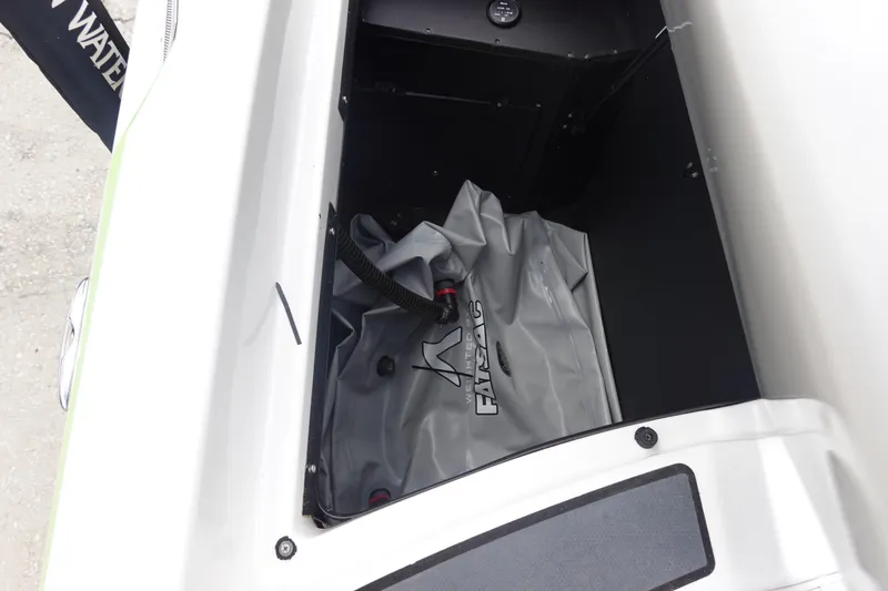 Slide: The Image of 2015 Tigé R20 boat storage compartment with FatSac ballast bag. - 28