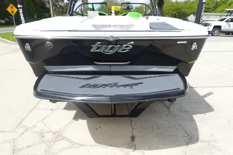 Slide: The Image of 2015 Tigé R20 boat rear view with swim platform, parked outdoors. - 5