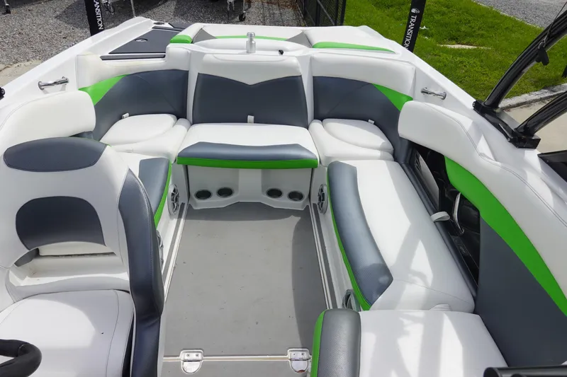 Slide: The Image of 2015 Tigé R20 boat interior with white, gray, and green seating, showcasing modern design. - 9