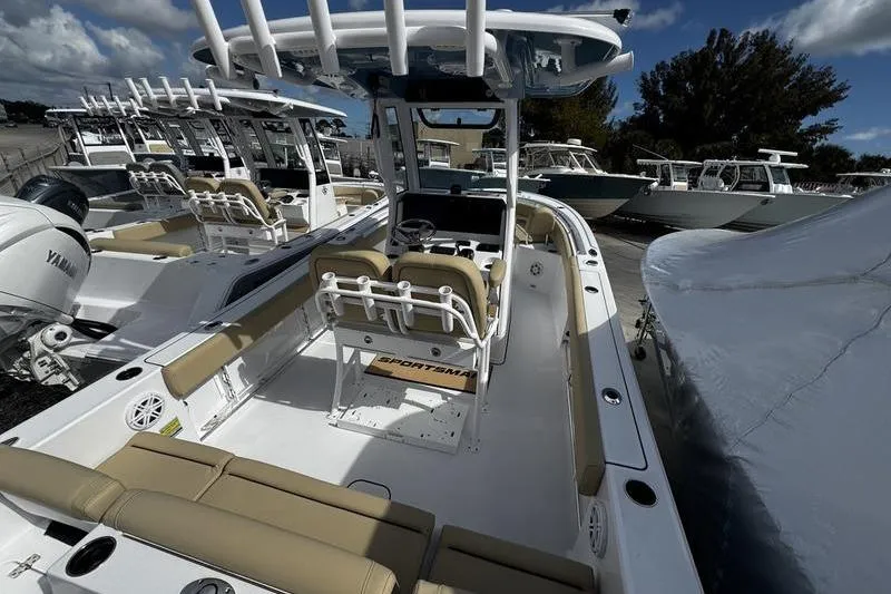 The Image of 2026 Sportsman Heritage 231 Center Console boat with beige seating and modern design. - 1