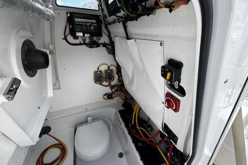 Slide: The Image of Interior of 2026 Sportsman Heritage 231 Center Console boat, showing wiring and equipment. - 14
