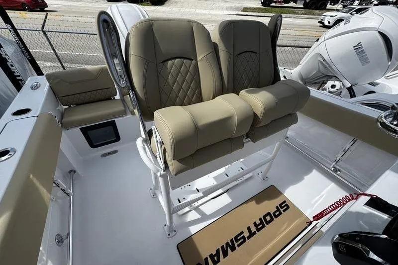 Slide: The Image of 2026 Sportsman Heritage 231 Center Console boat with tan seating and Yamaha engine. - 17