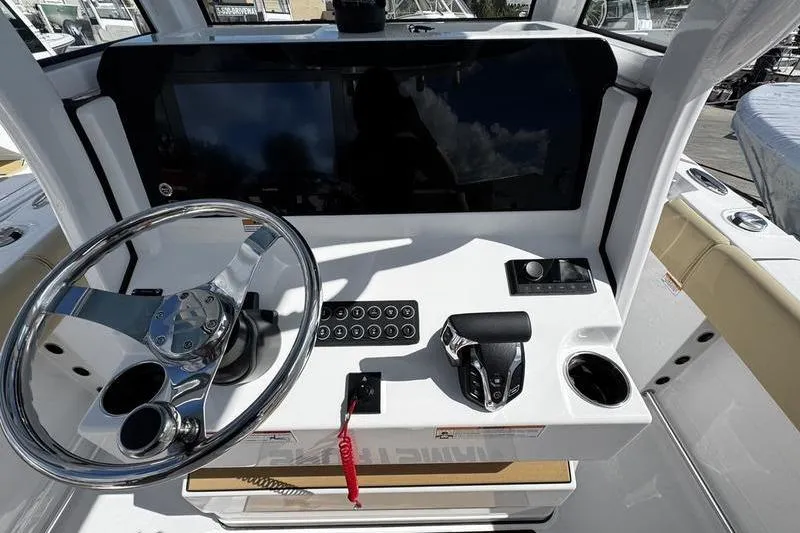 Slide: The Image of 2026 Sportsman Heritage 231 Center Console dashboard with steering wheel and controls. - 21