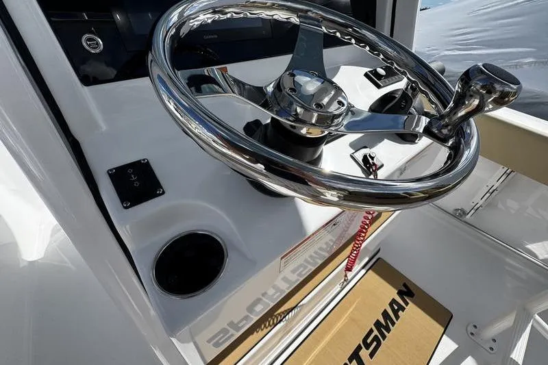Slide: The Image of Steering wheel of 2026 Sportsman Heritage 231 Center Console boat, showcasing sleek design. - 23