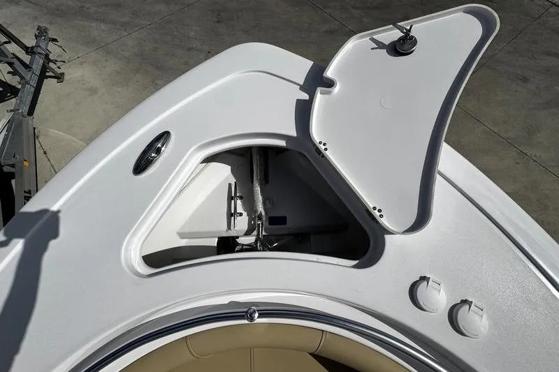 Slide: The Image of Open storage compartment on 2026 Sportsman Heritage 231 Center Console boat deck. - 4