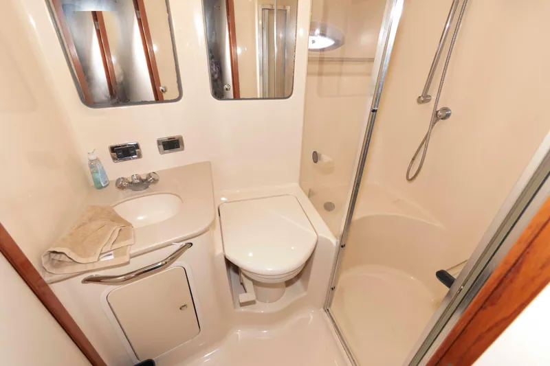 Slide: The Image of Luxurious bathroom in 2003 Sea Ray 480 Sedan Bridge yacht with shower and vanity. - 23
