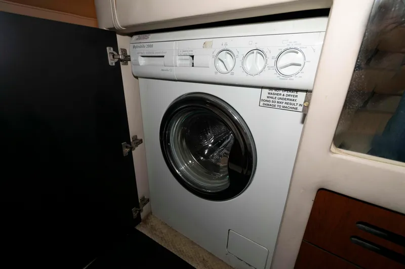 Slide: The Image of Washing machine inside 2003 Sea Ray 480 Sedan Bridge yacht cabin. - 24