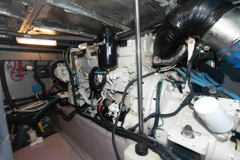 Slide: The Image of Engine room of a 2003 Sea Ray 480 Sedan Bridge yacht, showcasing mechanical components. - 25