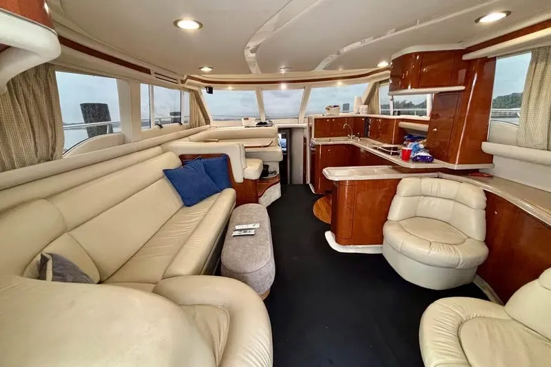 Slide: The Image of Luxurious interior of a 2003 Sea Ray 480 Sedan Bridge yacht with leather seating. - 9
