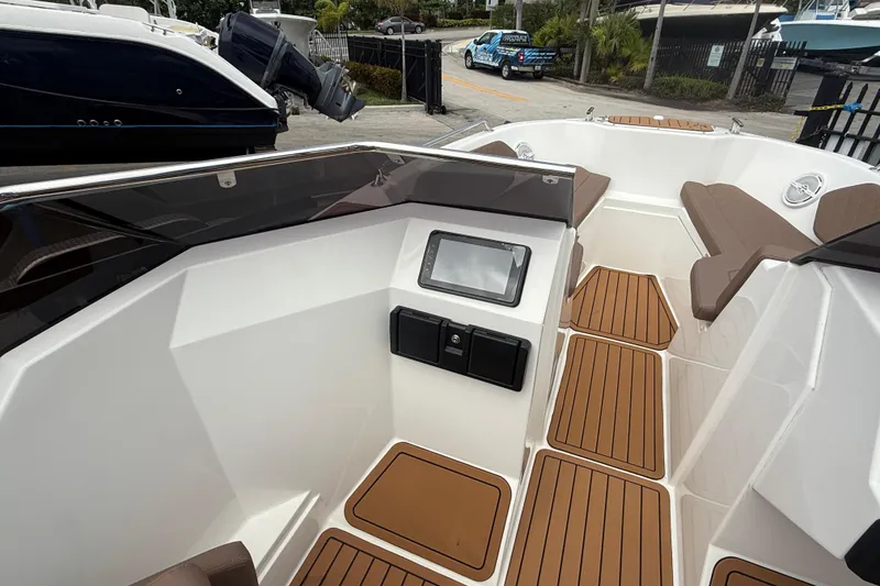 Slide: The Image of Modern 2025 Drive Wave 570 boat interior with sleek design and wood-patterned flooring. - 17