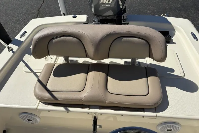 Slide: The Image of 2016 Scout 177 Sport boat with beige cushioned seating and Yamaha 90 engine. - 16