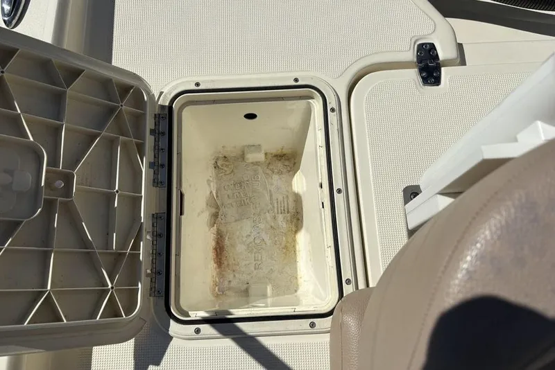 Slide: The Image of Open storage compartment on a 2016 Scout 177 Sport boat. - 22