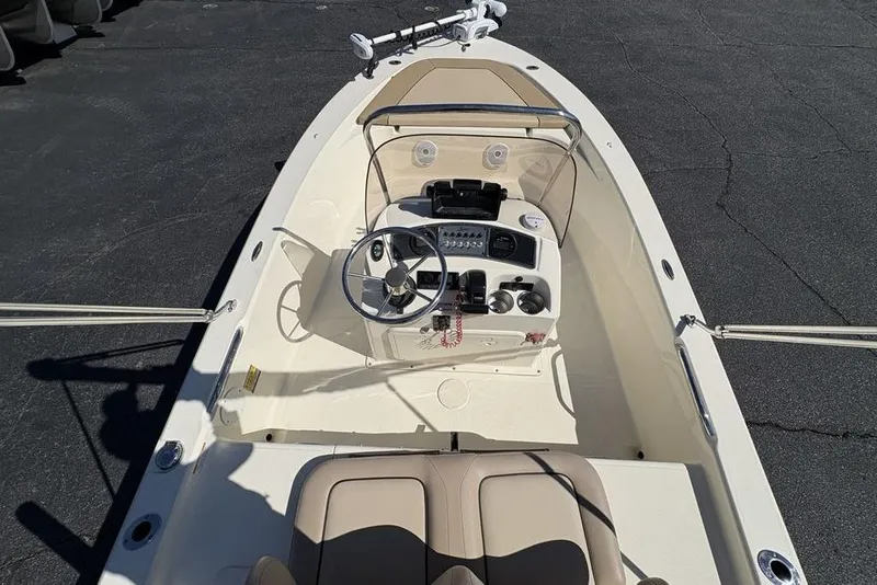 Slide: The Image of 2016 Scout 177 Sport boat interior with steering wheel and control panel. - 23