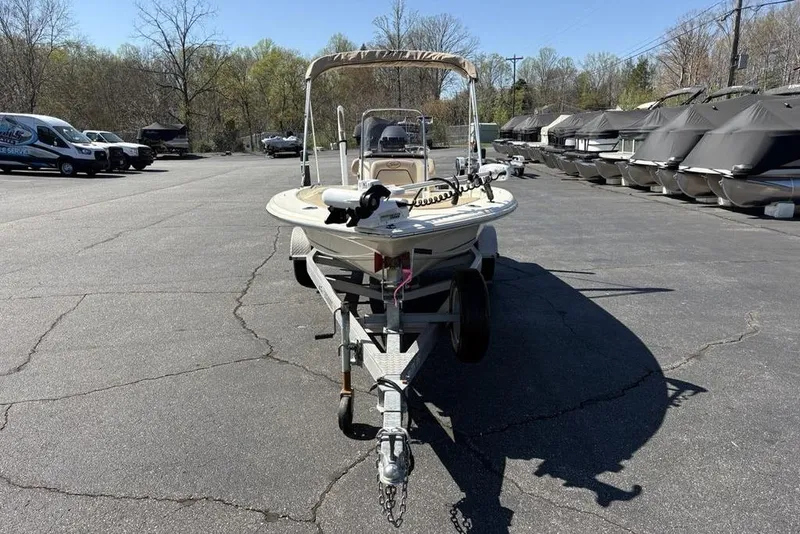 Slide: The Image of 2016 Scout 177 Sport boat on trailer in outdoor parking lot. - 3
