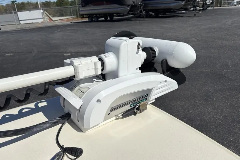 Slide: The Image of Minn Kota trolling motor on 2016 Scout 177 Sport boat, parked outdoors. - 7