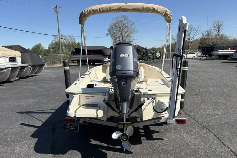 Slide: The Image of 2016 Scout 177 Sport boat with 90 HP engine, parked in a marina. - 8
