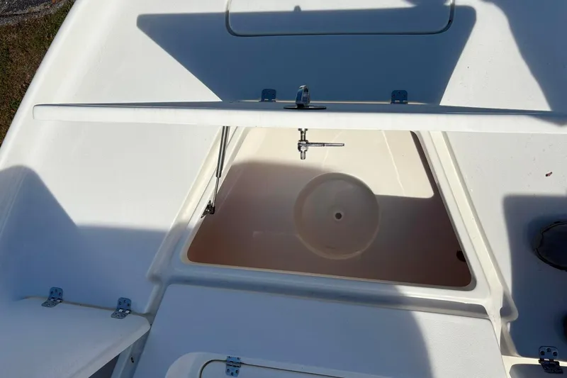 Slide: The Image of Open storage compartment on 2026 Key West 230 Bay Reef boat. - 8