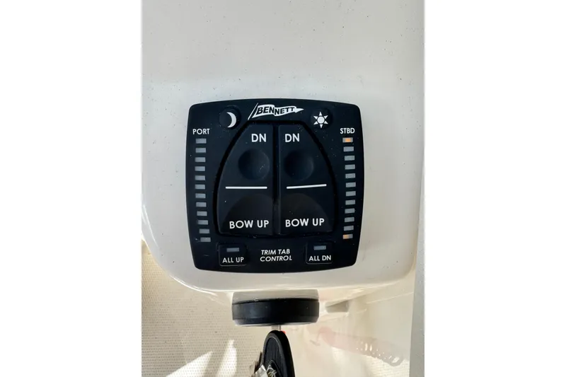 Slide: The Image of Bennett trim tab control panel on 2025 Sailfish 245 DC boat. - 10