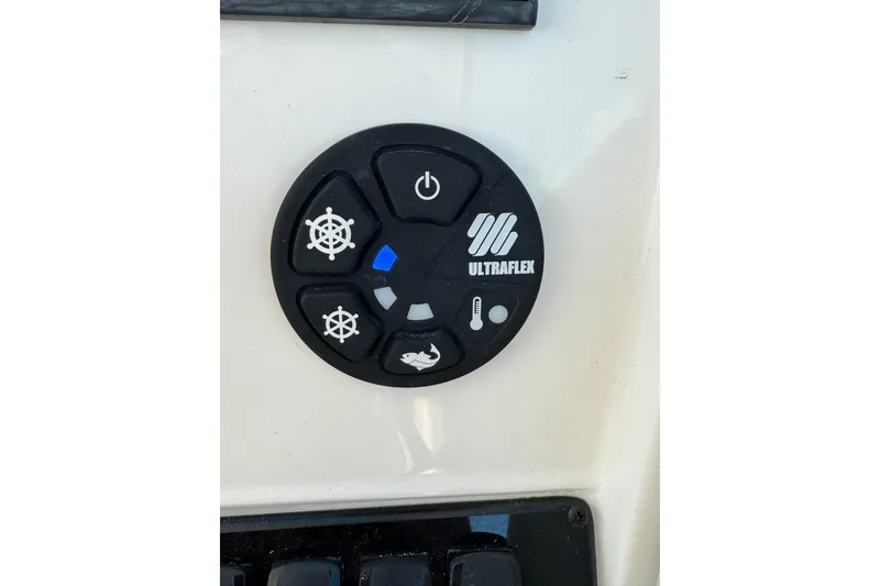 Slide: The Image of Ultraflex control panel on 2025 Sailfish 245 DC boat dashboard. - 8