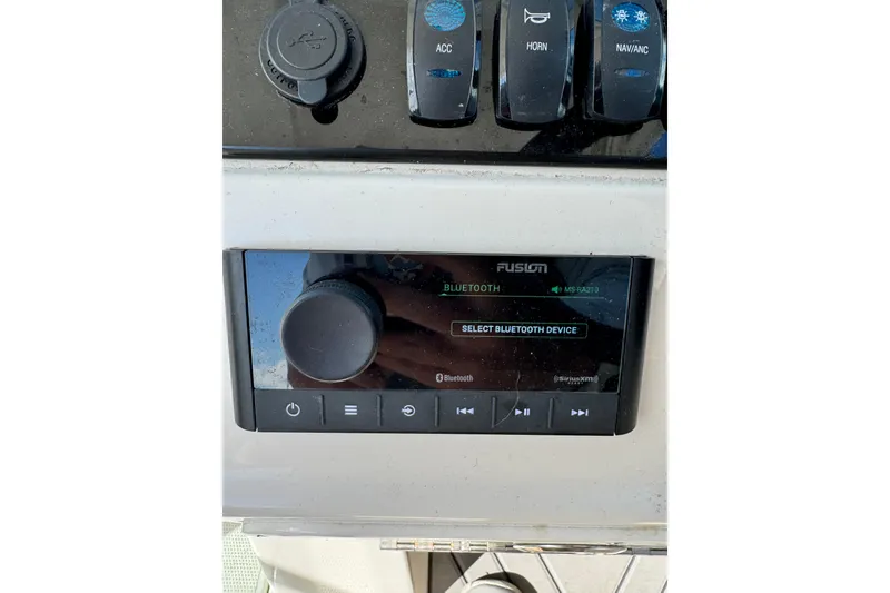 Slide: The Image of Control panel of 2025 Sailfish 245 DC boat with Bluetooth audio system. - 9