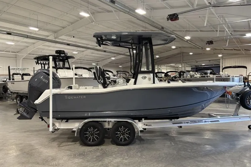 The Image of 2026 Tidewater 210 CC Adventure boat on trailer in showroom. - 0