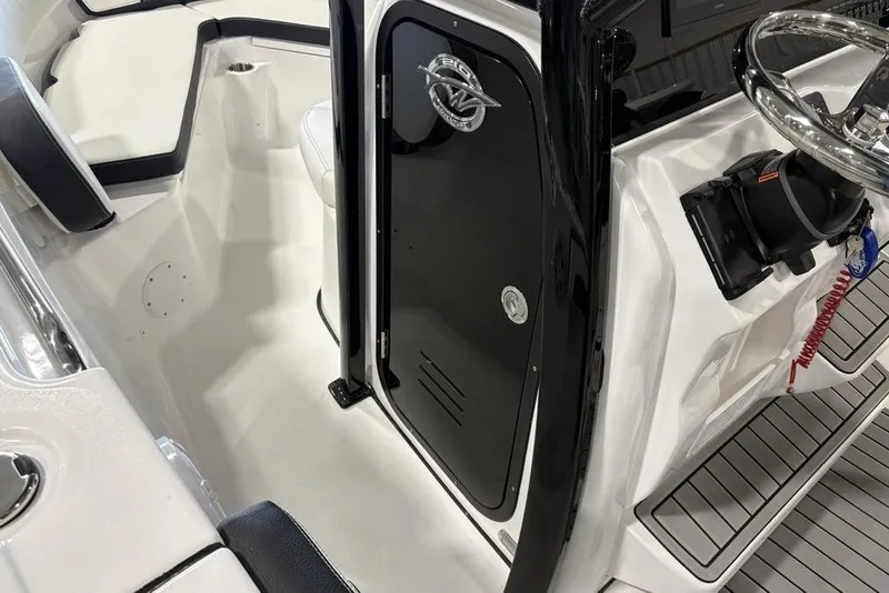 Slide: The Image of 2026 Tidewater 210 CC Adventure boat interior with sleek design and modern controls. - 10