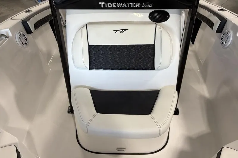 Slide: The Image of 2026 Tidewater 210 CC Adventure boat interior with cushioned seating and sleek design. - 11