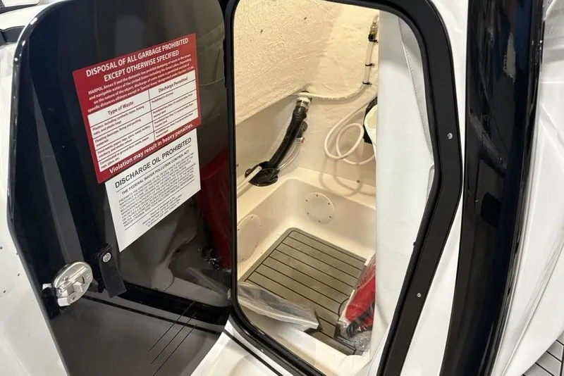 Slide: The Image of Interior view of 2026 Tidewater 210 CC Adventure boat's storage compartment. - 16