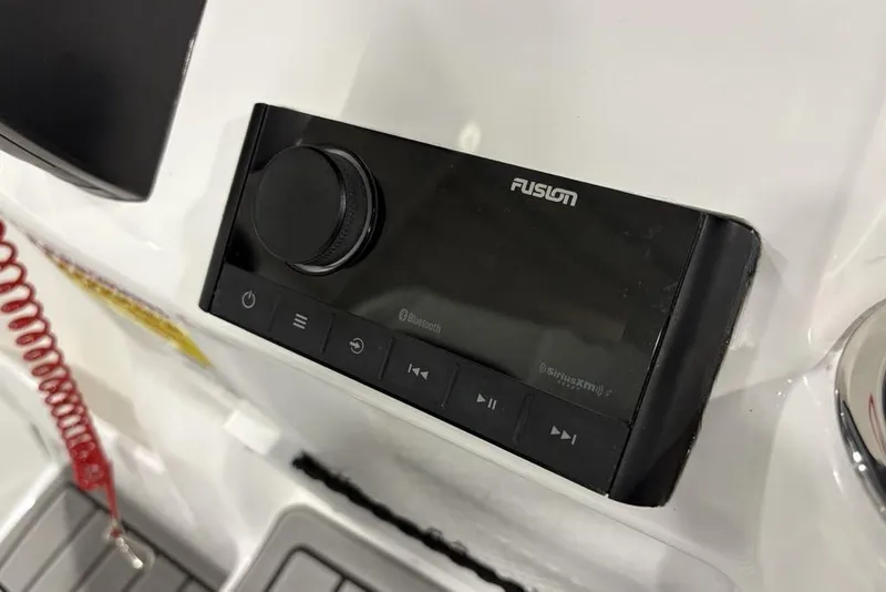 Slide: The Image of Fusion audio system on 2026 Tidewater 210 CC Adventure boat dashboard. - 17