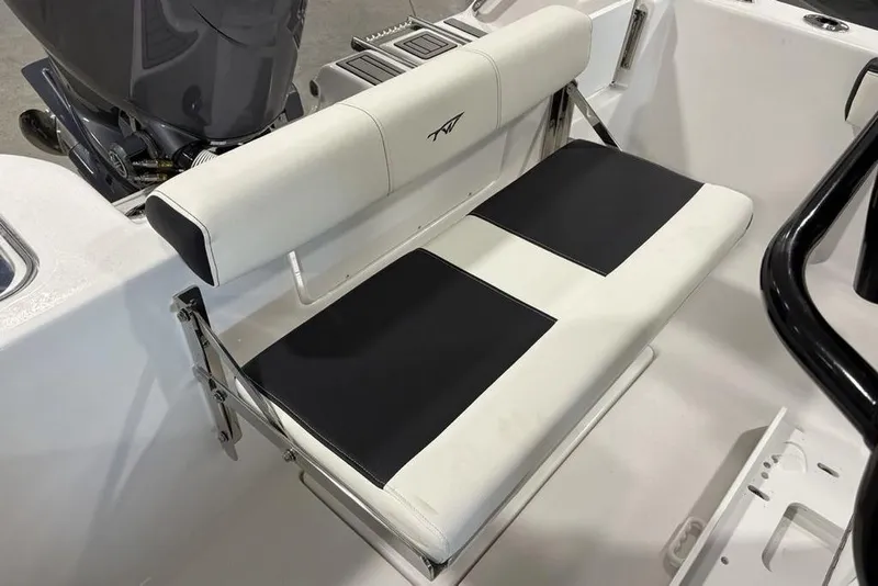Slide: The Image of 2026 Tidewater 210 CC Adventure boat seat with black and white upholstery. - 22