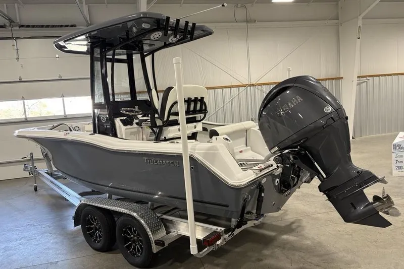 Slide: The Image of 2026 Tidewater 210 CC Adventure boat on trailer in indoor storage. - 3