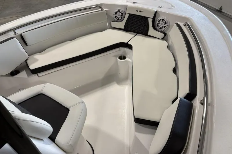 Slide: The Image of 2026 Tidewater 210 CC Adventure boat interior with cushioned seating and modern design. - 7