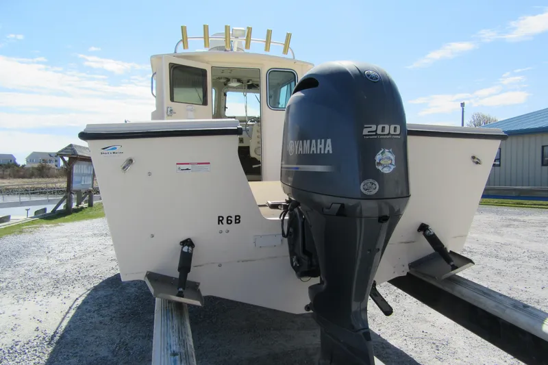 Slide: The Image of 2006 Parker 2120 Sport Cabin boat with Yamaha 200 engine on trailer. - 2