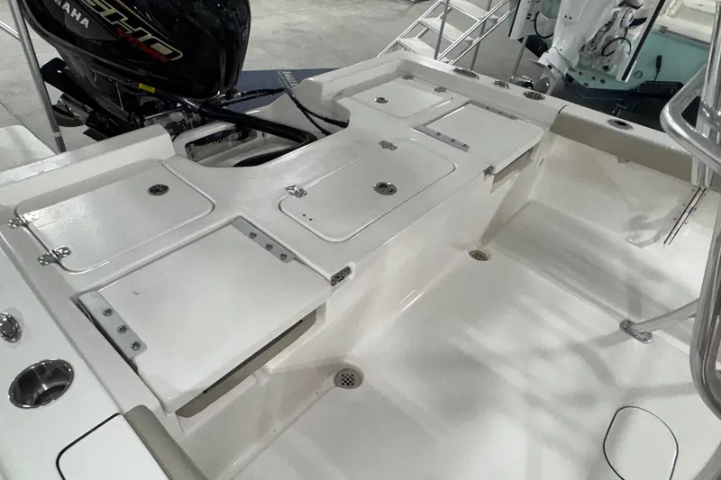 Slide: The Image of 2026 Key West 230 Bay Reef boat deck with storage compartments and Yamaha engine. - 13