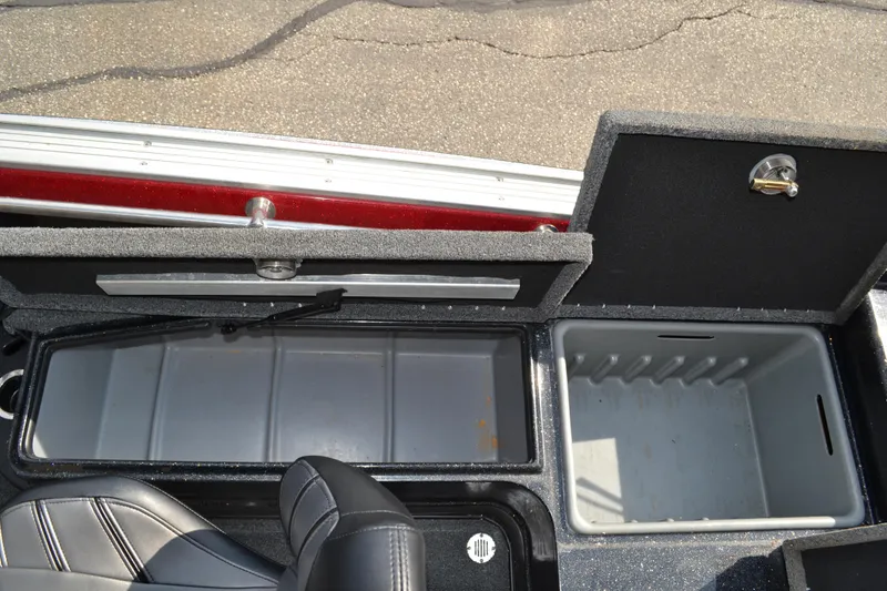 Slide: The Image of 2022 Nitro ZV20 boat storage compartments with open lids, showcasing interior space. - 13