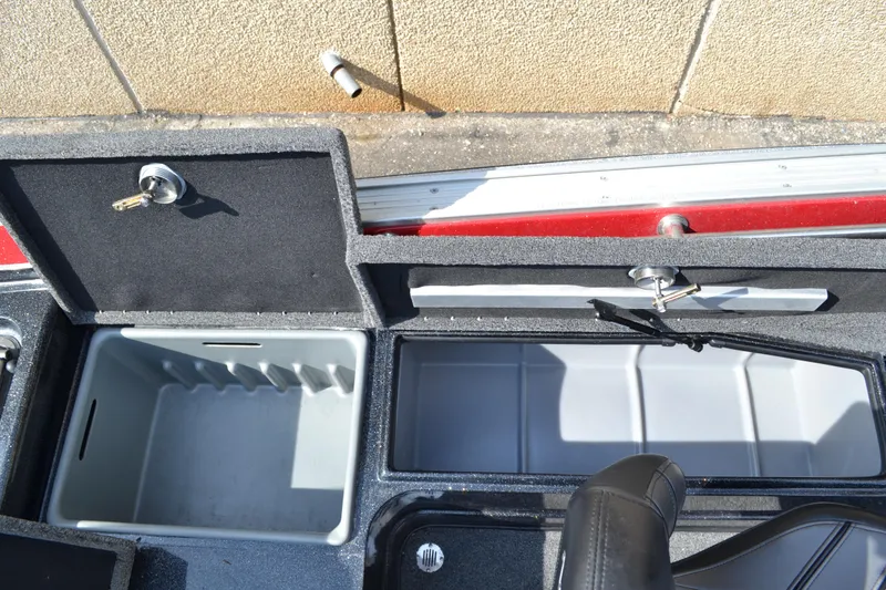 Slide: The Image of 2022 Nitro ZV20 boat storage compartments with secure locks and seating. - 15