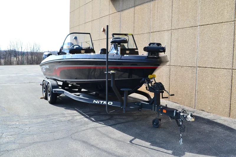 Slide: The Image of 2022 Nitro ZV20 boat on trailer parked beside a building. - 4