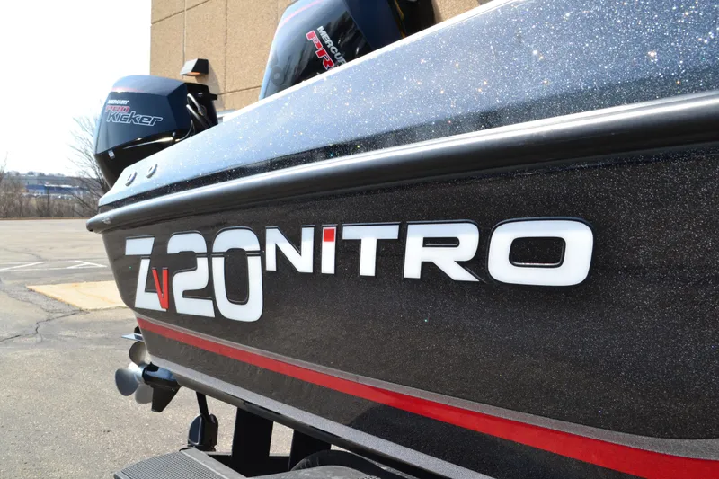 Slide: The Image of 2022 Nitro ZV20 boat with Mercury engine, parked outdoors. - 7
