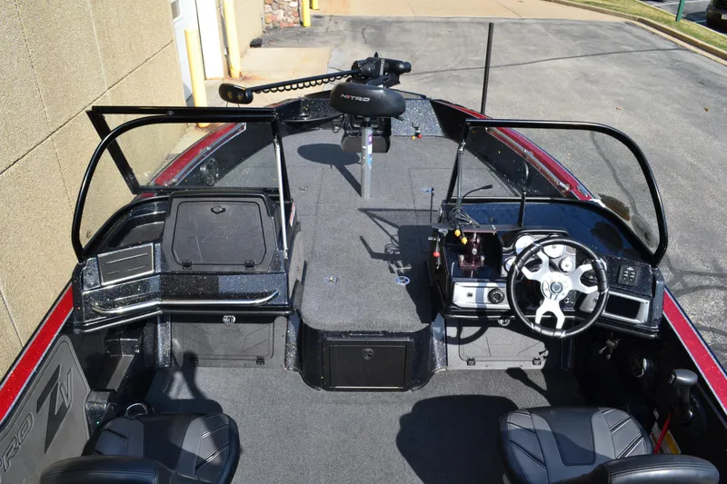 Slide: The Image of 2022 Nitro ZV20 boat interior with steering wheel, seating, and control panel. - 9